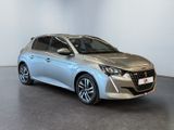 a silver car is parked in a white room with a black floor