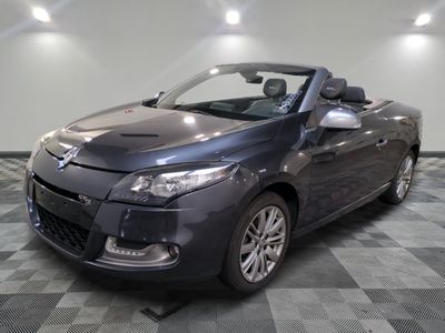 a picture of a grey car parked in a garage