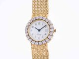 a lady ' s gold and diamond wrist watch