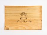 a wooden box with a picture of a coat of arms on it