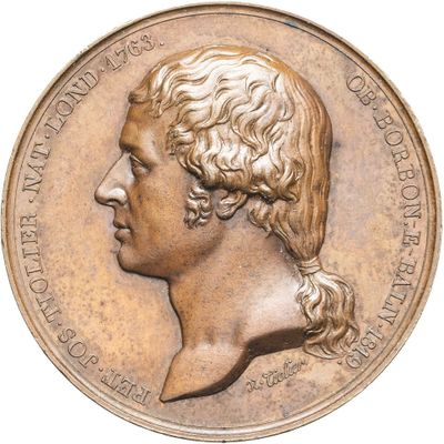 une image d'un gros plan d'une médaille sur fond blanc