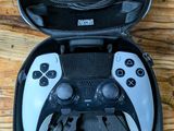 a black case with two controllers in it on a wooden table