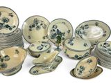 a lot of plates and bowls that are sitting on a table