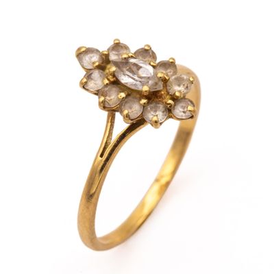 an image of a gold ring with a cluster of white diamonds