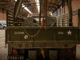 a military truck with a chain on the back of it