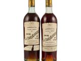 two bottles of bourbon are sitting next to each other on a white surface