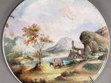 une photo d'un tableau posé sur une assiette accrochée au mur