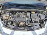 the engine of a car with its hood open and the hood up