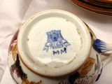 a tea pot that has a blue and white design on it