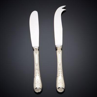 pair of silverplated cheese knives with floral decoration