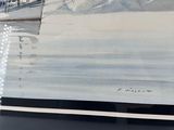a painting of a sailboat on display in a glass case