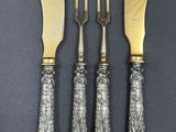 a set of four antique silverplated knives and forks