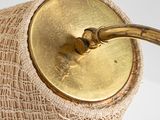 a lamp that is on a table with a burlock wrapped around it