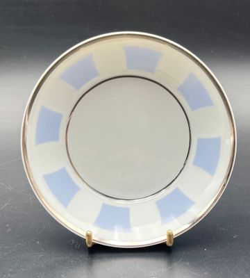 an image of a blue and white plate sitting on a table
