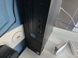 a desktop computer sitting on a desk next to a keyboard and mouse