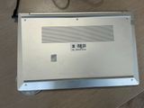 a laptop computer sitting on top of a wooden table