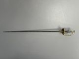 a close up of a sword with a gold handle on a white surface