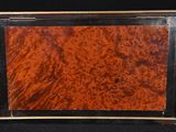 a close up of a wooden box on a black background