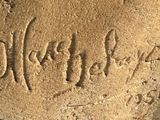 a close up of a stone with writing on it