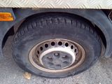 a flat tire on the side of a truck