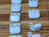 a lot of airpods that are sitting on a table