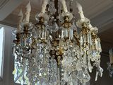 a chandelier hanging from the ceiling in a room
