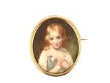 a small picture of a little girl holding a cat
