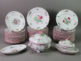 a lot of plates and bowls with flowers on them