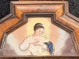 a picture of a woman holding a cat in a picture frame