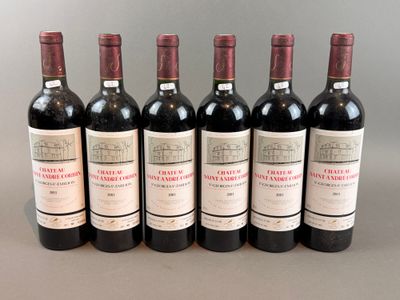six bottles of red wine lined up in a row on a table