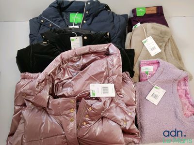 many jackets and jackets that are on display in a store