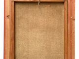 an old wooden frame with a cork board attached to it