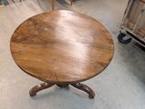 a wooden table that is sitting in the middle of a room