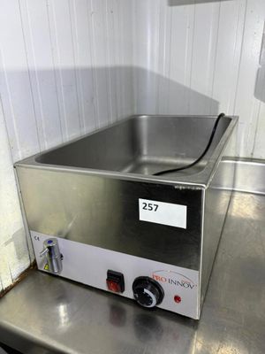 stainless steel counter top with a hot plate on top of it
