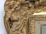 a picture of a gold frame with a picture on it