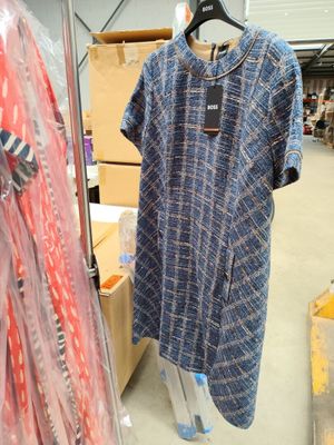 a dress hanging on a hanger in a store