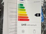an energy label on a piece of paper next to a piece of paper