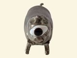 an image of a sculpture of a dog with a big eye