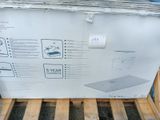 a box that has a laptop on it on a pallet