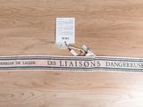 a picture of a sign on a wooden floor