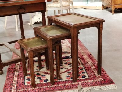 three tables that are sitting on a rug in a room