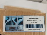 a box with a label on it sitting on a bed