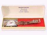 an image of a watch in a box on a white surface