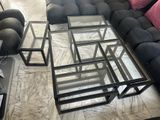 a black couch and a coffee table in a living room