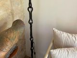 a lamp that is next to a bed in a room