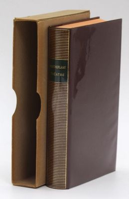 a brown book with a brown cover sitting in a cardboard box