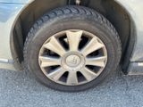 a close up of a car ' s tire on the road