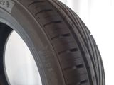 a close up of a tire on a white surface