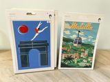 two boxes that have a picture of a city on them