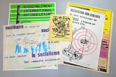 several pamphlets of various types of paper on a table
